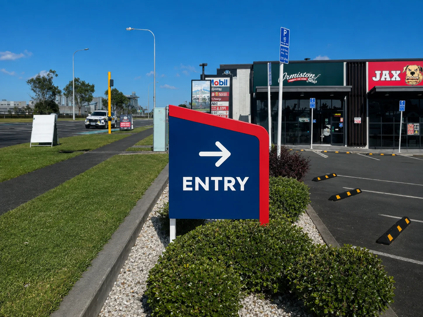 Mobil Ormiston entry wayfinding sign designed in Mobil blue and red