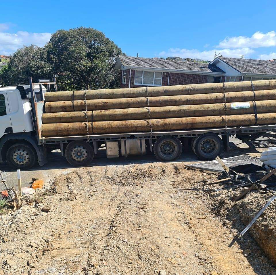 Truck delivering retaining materials to a prepared site