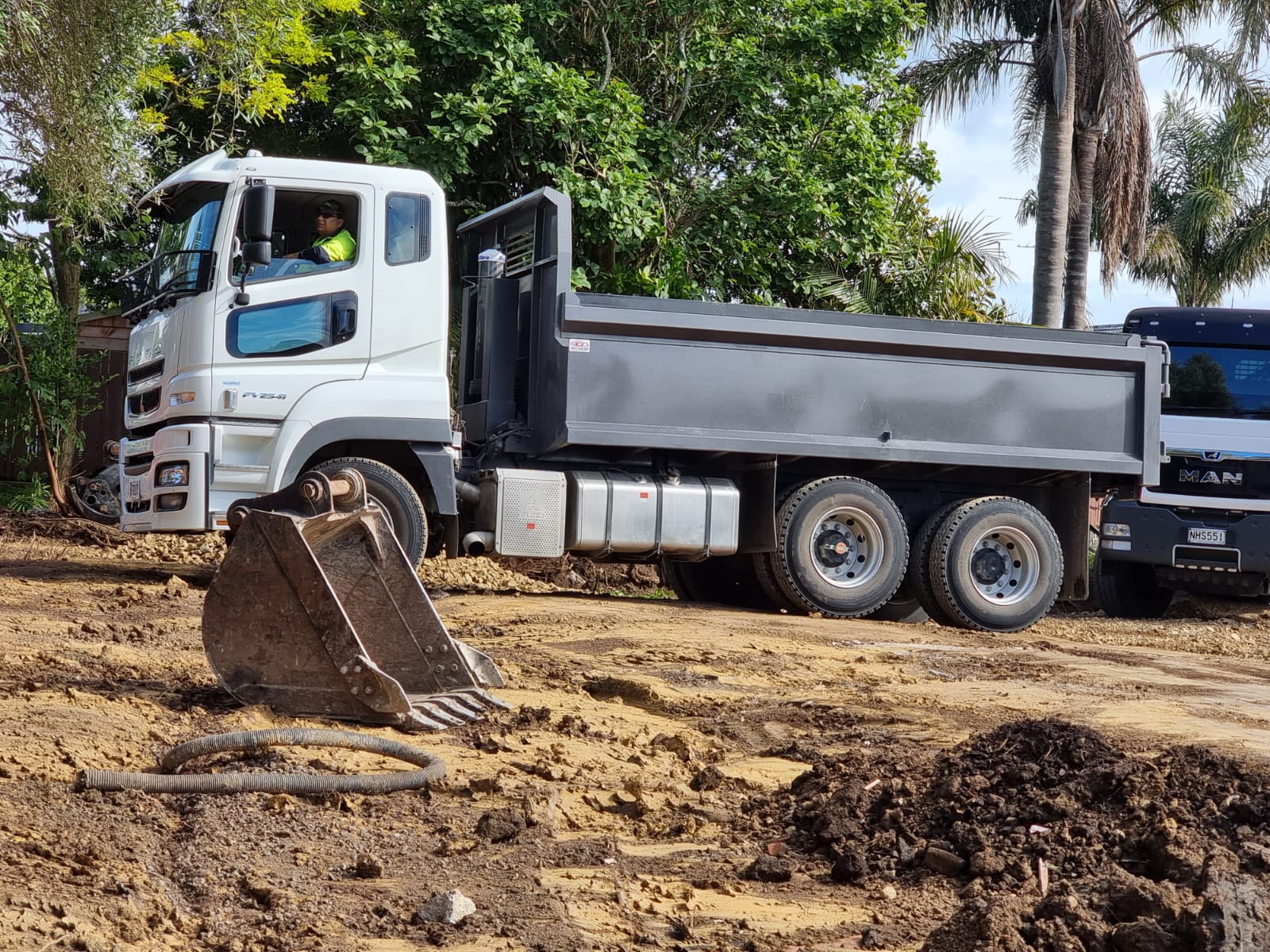 Tipper truck and excavator on a civil earthworks site