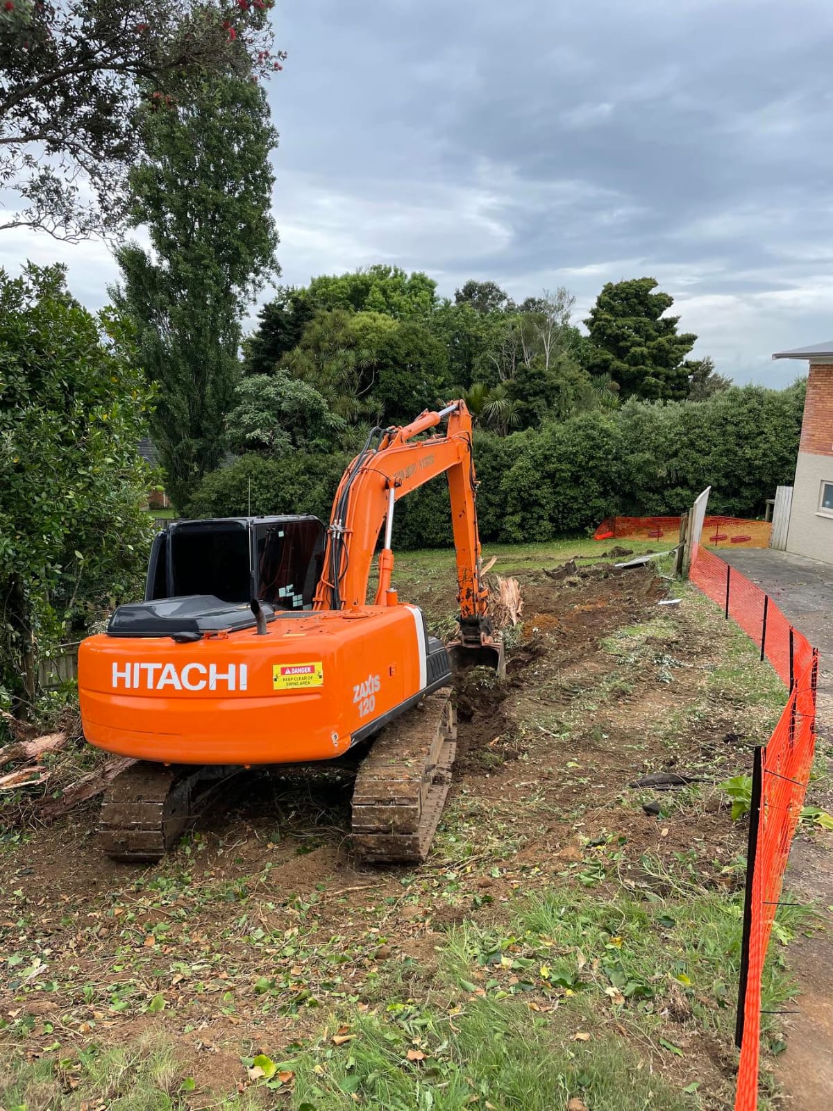 Excavator working in a narrow residential area